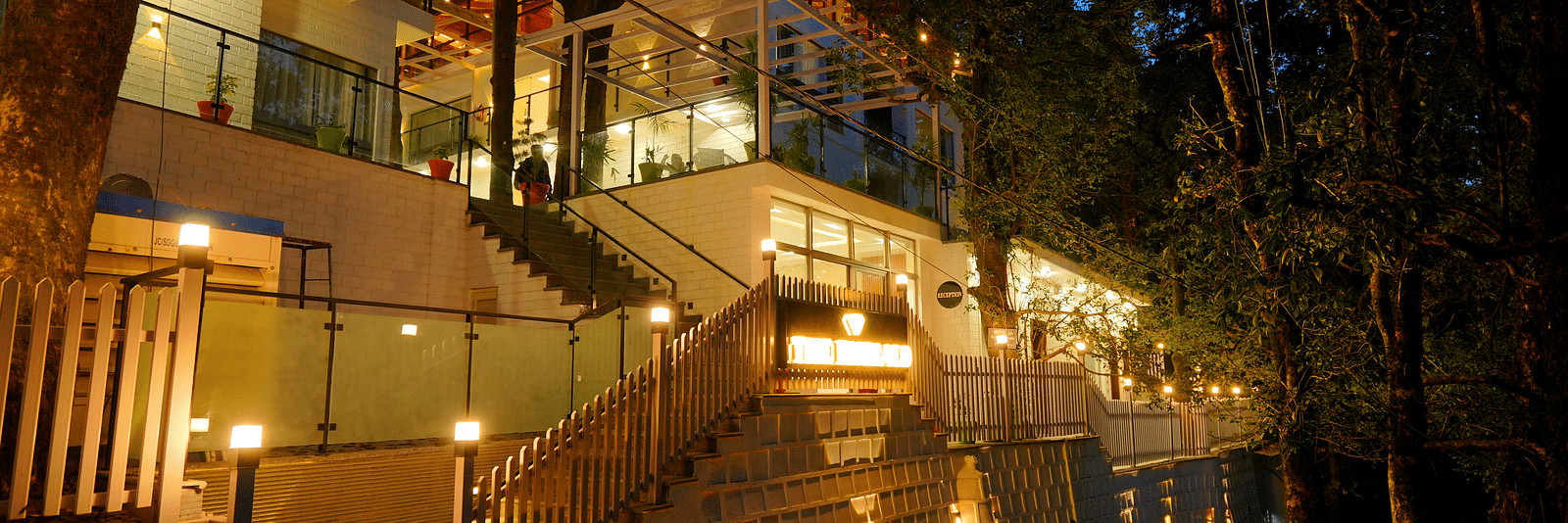 A facade image shot at night  of DLS The Emerald, Nainital which is lit with bright lighting